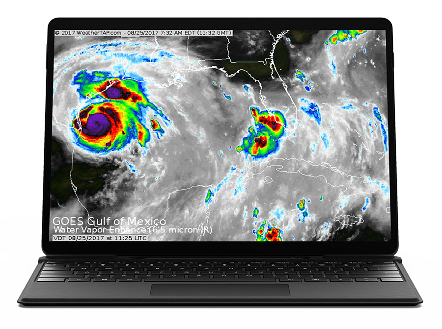 satellite image of hurricane on laptop